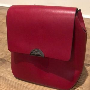Red faux leather backpack